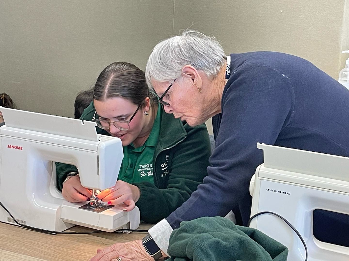 YATZ student learning to sew