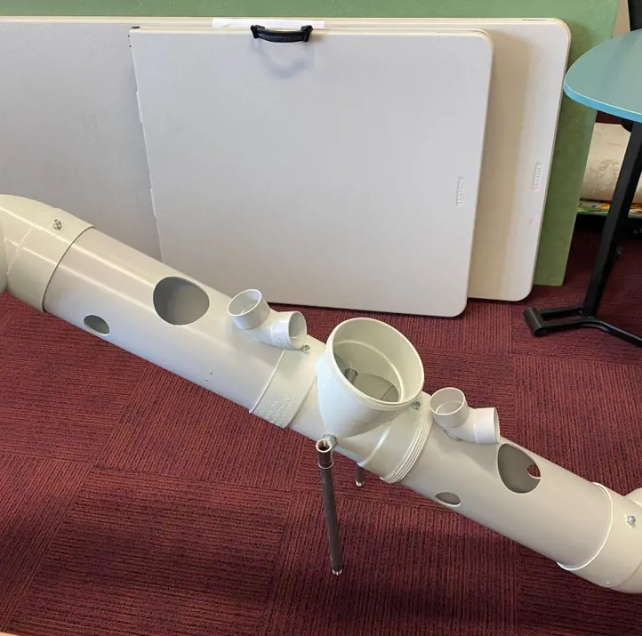 STEM enrichment device for meerkats designed by school students using PVC pipe.