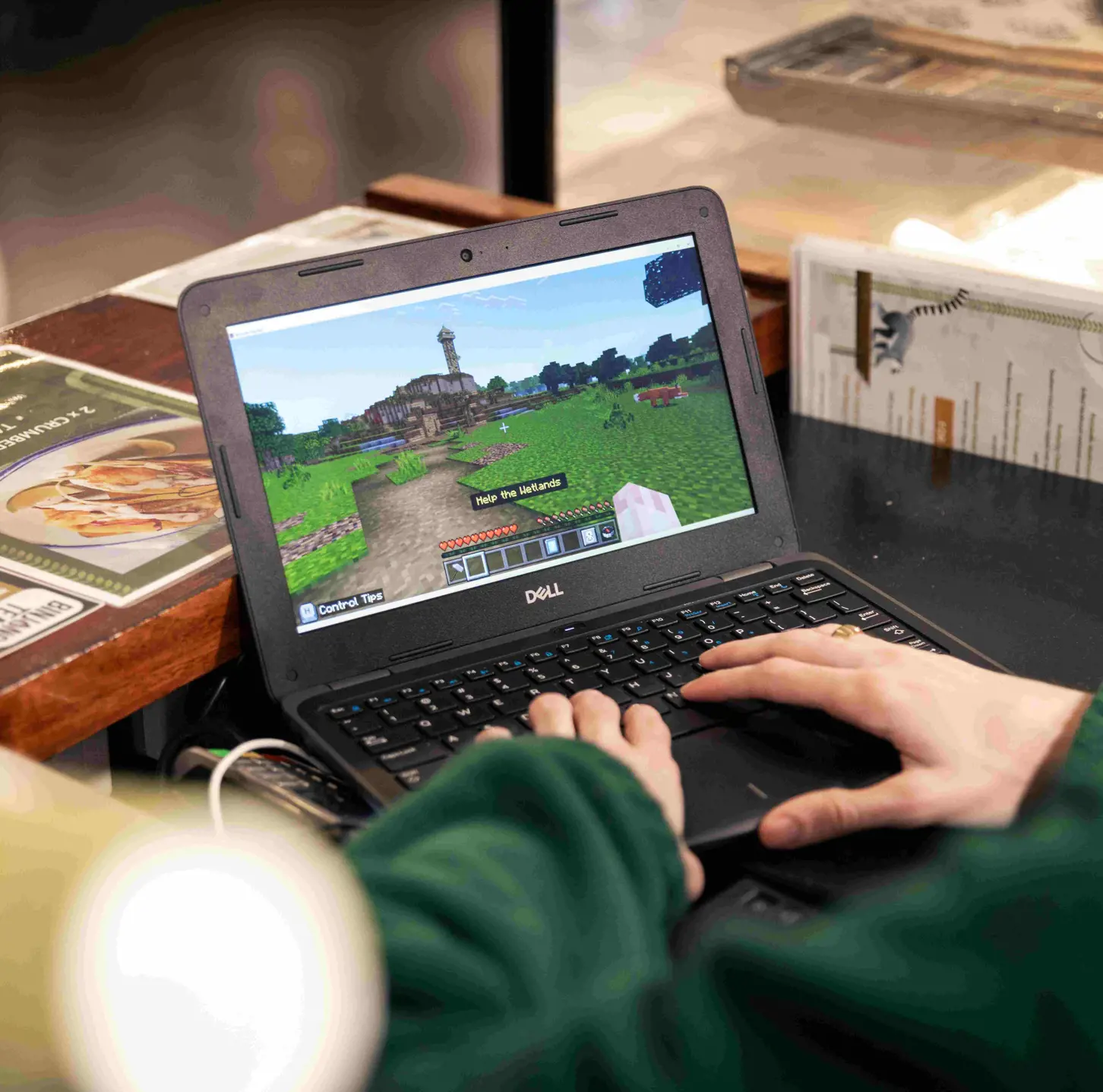 Student using Minecraft Education on a laptop during a classroom learning activity.