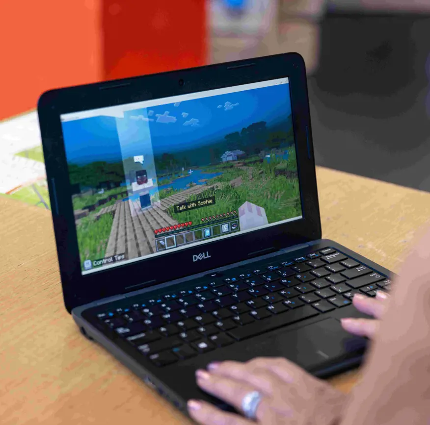 Student using Minecraft Education on a laptop during a classroom learning activity.