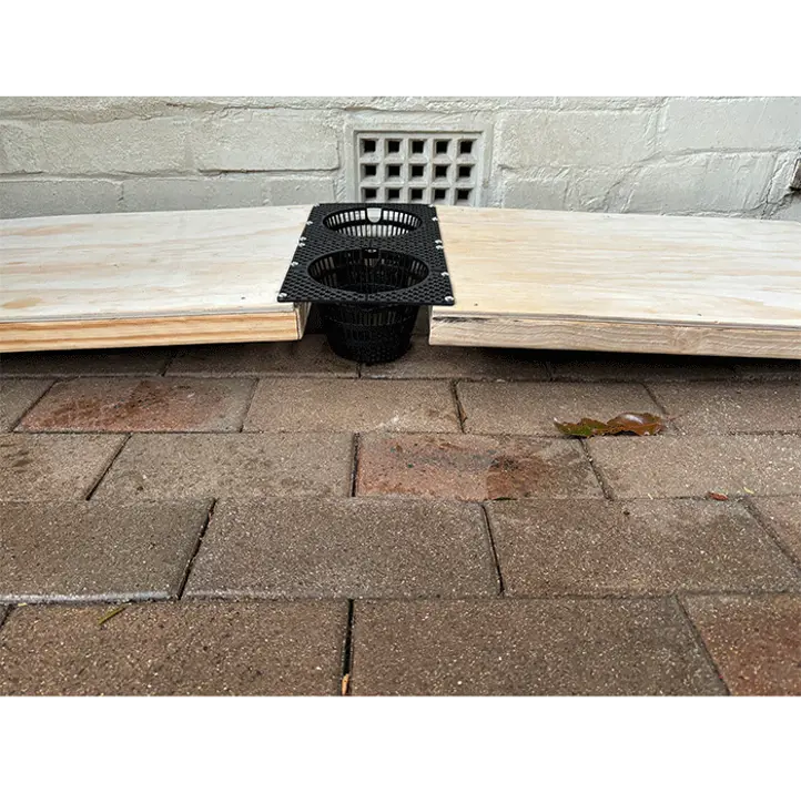 STEM‑designed enrichment device for platypuses featuring a raised platform and basket.