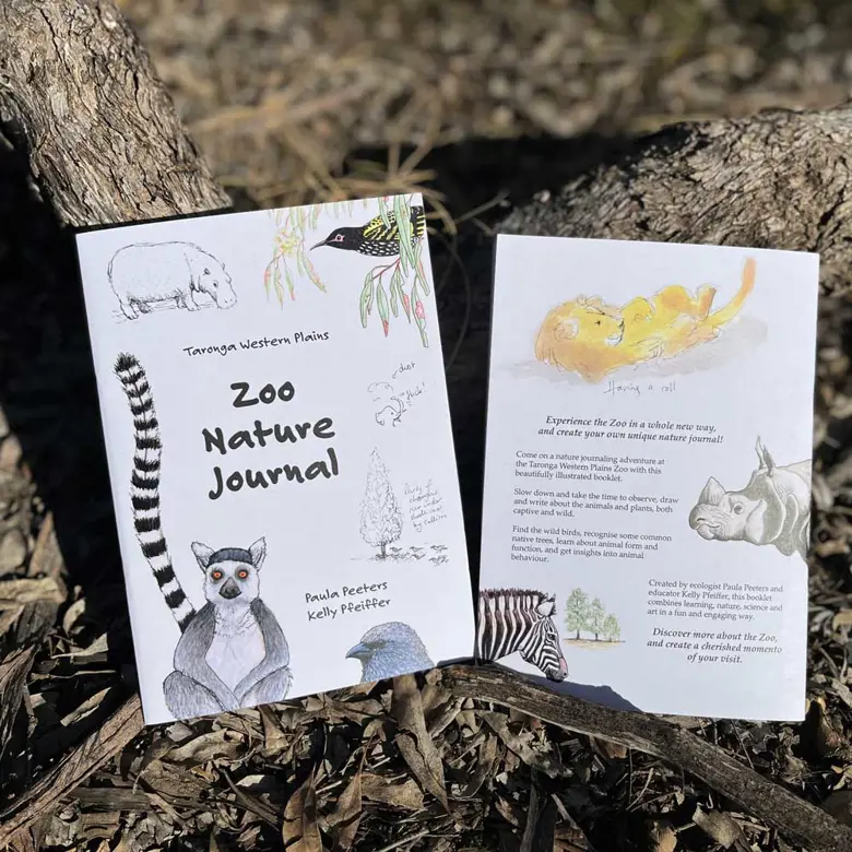 Zoo Nature Journal booklets displayed outdoors for a self‑guided nature learning activity.
