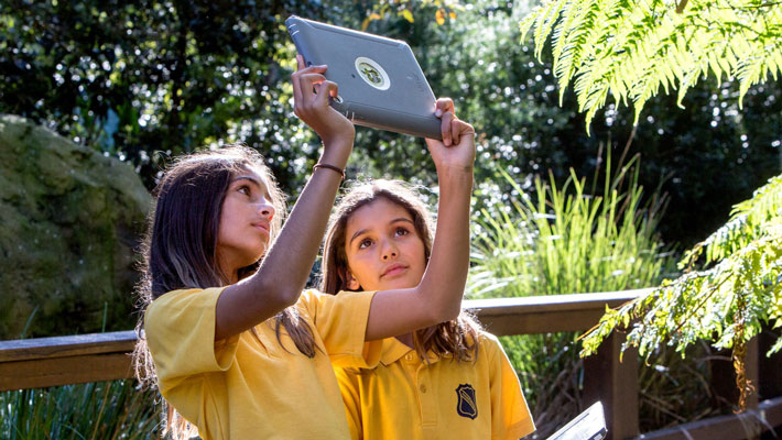 Children looking at iPad