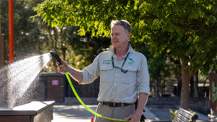 Employee watering garden