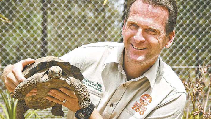 Taronga Western Plains Zoo Precinct Manager Bruce Murdock with a Tortoise. Image: Wendy Merrick for Dubbo Photo News