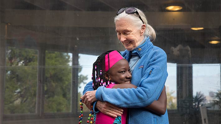 Dr Jane Goodall with a member of the 100% Hope Choir from Uganda. Photo: Rick Stevens