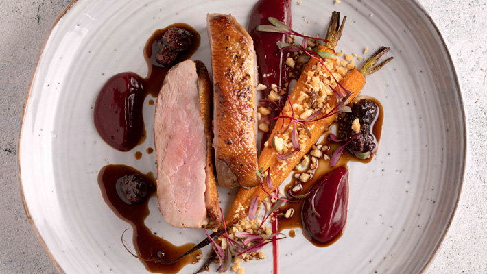 Duck breast w/ beetroot, carrots, macadamia & blackberry sauce.